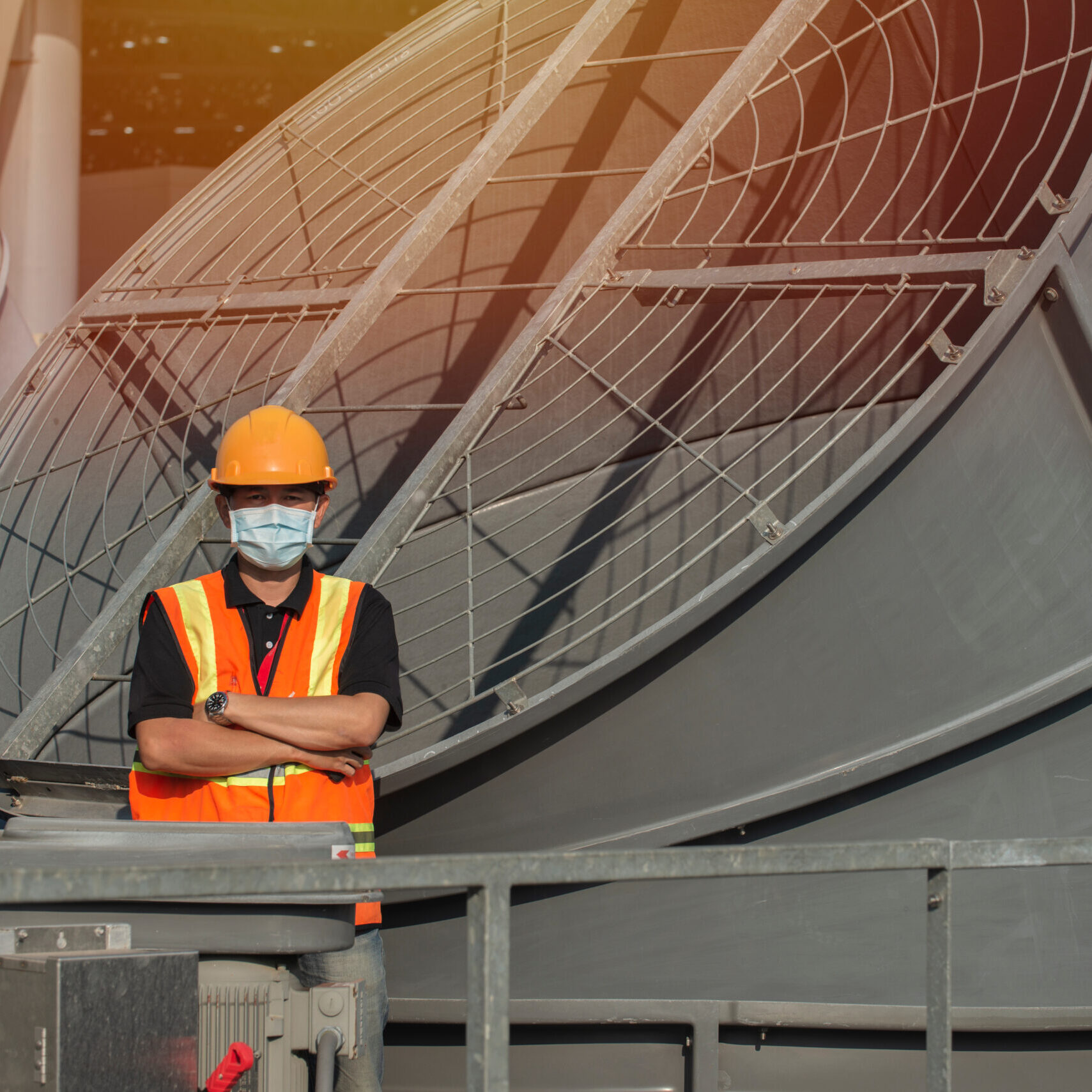 Portrait,Engineer,With,Cross,Arms,On,Cooling,Tower.,Engineer,People